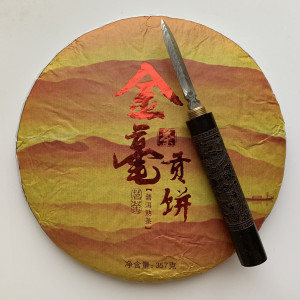 Шу пуэр Tribute Gold Cake Цзиньхао 2017 года 357 г. Photo 2